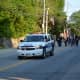 A Mount Kisco police vehicle leads the parade.