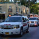 A procession of Chappaqua Fire Department vehicles in the Mount Kisco parade.