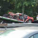 The vehicle involved in the fatal crash being placed on a tow truck Wednesday morning.