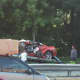 Tow workers remove the 2010 Camaro from the side of the northbound Saw Mill River Parkway after a driver died in a 30-foot fall from the Ashford Avenue Bridge in Ardsley.