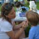Face painting was one of the activities offered at the Chappaqua summer concert.