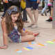 Children had their own chalk art fun during the Sidewalk Chalk Art Festival at Cross County Shopping Center.