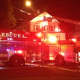 Norwalk firefighters on the scene at a fire on Larsen Street on Monday night.