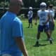 Ardsley High School football coach Colin Maier puts his squad through a drill at summer practice.