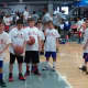 Young basketball players at the Iman Shumpert Camp in Ardsley get ready for a dribbling drill.