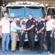Westport Firefighter Dan Mascolo and his family were presented with a donation from The Umbrella Club on Sept. 12. 