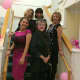 The team of Atria Darien and Helen Ainson fashions pose after the event.