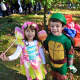 Young children dressed in all kinds of costumes. 