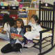 A high school student reads to a future class of 2027 student.