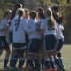 Wilton girls celebrate a goal during a game this season. The team went 8-1-2 and earned a share of the league title.