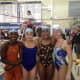 Mamaroneck's state-qualifying medley relay team, from left, Alexa Parry, Tessa Garces, Nicole Parry and Theresa Pace in Ithaca on Saturday.
