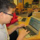 Students work on their laptops. 