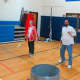 Faculty play a game of badminton. 