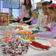 First-graders at Carrie E. Tompkins Elementary School in Croton-Harmon celebrated the beginning of the holiday season by creating candy houses with their parents.