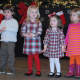 Children participate in the holiday sing-a-long.