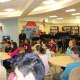 Students listen to a presentation given about the library. 