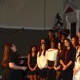 The high school chorus performs at the annual holiday concert.