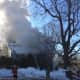 Smoke pours from the fire at 266 Range Road on Saturday. 
