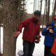 Steve Conaway shows the preferred spot to tap a maple tree.
