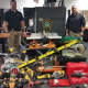 Norwalk detectives with the power tools recovered as a result of their investigation.