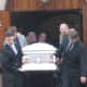 Pall bearers carrying Lacey Carr's casket at her funeral Friday.