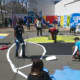 Students work on painting various areas at the park.