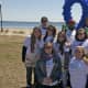 Walkers hit the beach on cool but sunny day at Calf Pasture in Norwalk. 