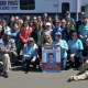 Volunteers from Backyard Humanitarian and the Stamford Police Department pose for a photo to remember Timothy Coppola.