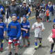 The Little League parade heads down Noroton Avenue on Sunday.