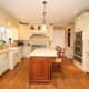 The kitchen at 120 Orchard Lane in New Canaan is spacious and includes top appliances.