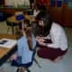 A teacher speaks to a world language student in the New Rochelle School District.