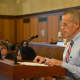 Mount Kisco Police officer Kevin Reilly speaks at the Board of Legislators' meeting.