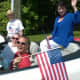 Weston Board of Education member and First Selectman candidate Nina Daniel rides in a convertible during the towns Memorial Day parade. Also depicted, from left, are Fred Schneider, Ellen Uzenoff and Joseph Colaprico.