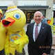 From left, Sunrise Rotary Club member Randy Christopherson, Liz Wong in the duck outfit, and First Selectman Jim Marpe.