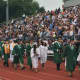 The Norwalk High School Class of 2015 walks off the field to thunderous applause from the audience after graduating Thursday.
