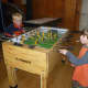 Two Dobbs Ferry boys enjoy games at the Embassy Community Center.