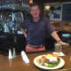 Bogey's Grille & Tap Room Co-Owner Jim Stablein with a Prime Beef Burger.