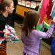 Tuckahoe elementary school students with pajamas and books for the "Stuff a Bus" campaign. 