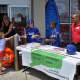 Jayden Gonzalez and Jake Palmer man the table outside Sports Authority along with co-manager Barry Jones.