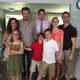 "Property Brothers" Jonathan and Drew Scott pose with the Royster family.
