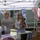 Deborah Connelly (left) and Sydney Bellinger, with Daisy Mae, all of Rye, N.Y., shop at the Rowayton Farmers Market.