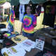 Vendors sell T-shirts and other souvenirs at the Fab 4 Music Festival at the Ives Center in Danbury.