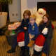 Santa meets with the Ongley siblings. From left, Caitlin, 7, Blake, 4, and Melissa, 6. 