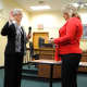 Incumbent Trustee Ann Gallelli is sworn in Monday by Village Clerk Paula DiSanto.