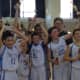 The St. Matthew's players and coaches celebrate their championship.