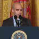 Mercy College graduate student David Padilla of the Bronx introduces President Obama at a White House event for veterans.