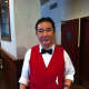 Waiter Mr. Wong has been serving food at the New China Inn almost as long as the restaurant has been open.
