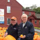Wilton Kiwanis members Dave Forslund, left, and Raymond Tobiassen are selling pumpkins outside the Wilton Historical Society. 