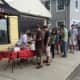 The crowds line up at Julian's Brick Oven Pizzeria for the Slice of Saugatuck Festival in Westport. 