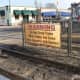 A sign at the train station in downtown Ramsey warns pedestrians not to cross the tracks when the safety gates are down.